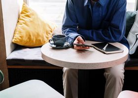 Cyclist planning a city ride at a cafe table